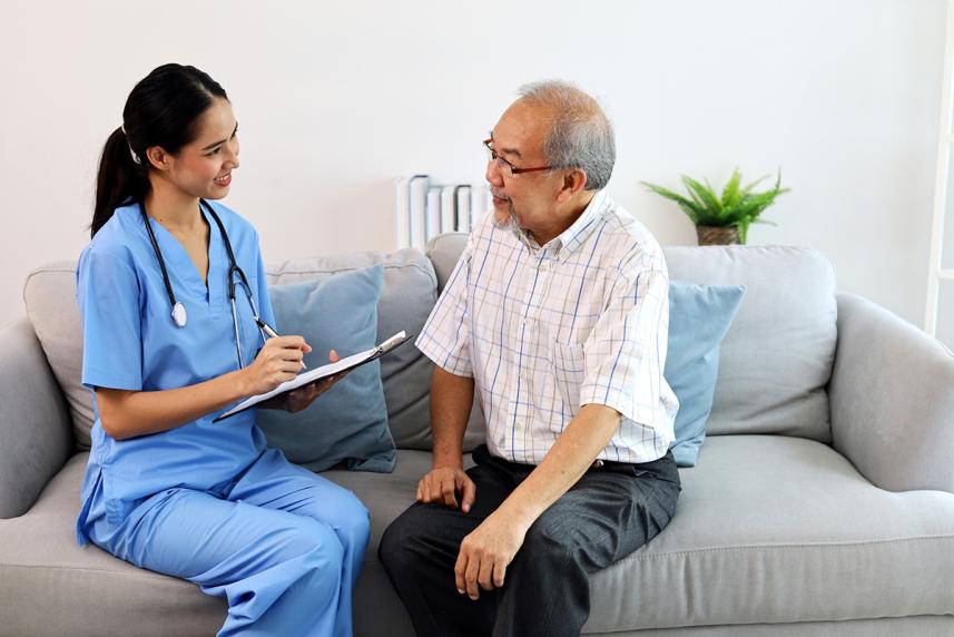 Nurse talking to patient about in-home health assessment