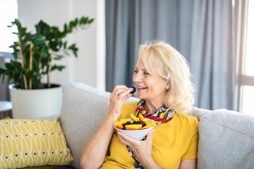 Woman eating fruit
